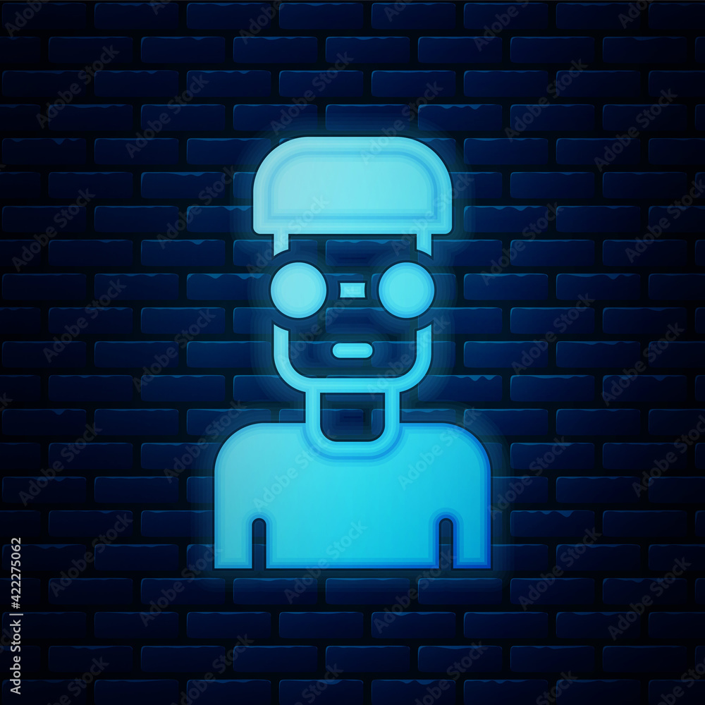 Poster glowing neon nerd geek icon isolated on brick wall background. vector