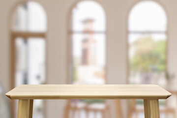 Obraz na płótnie Canvas Empty wood table top with cafe restaurant interior blur background