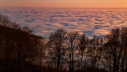 Beautiful sunset above the clouds at the famous Grandsberg, Bavarian forest, Bavaria, Germany