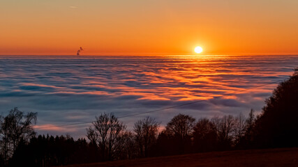Beautiful sunset above the clouds at the famous Grandsberg, Bavarian forest, Bavaria, Germany