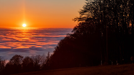 Beautiful sunset above the clouds at the famous Grandsberg, Bavarian forest, Bavaria, Germany