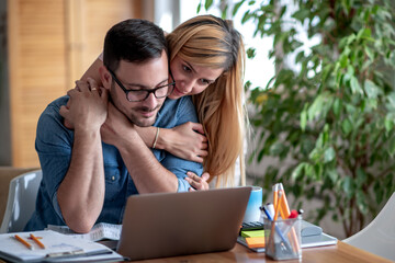 Worried couple checking finance budget