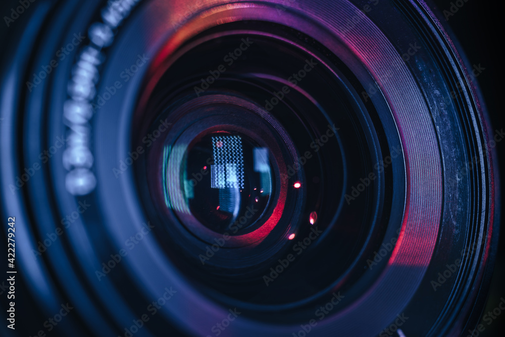 Leinwandbilder Close up Beautiful camera lens with multi colored light. Background pattern for design..