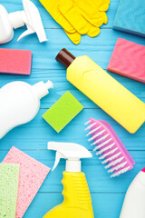 Set of cleaning tools on a blue background with copy space. Vertical foto