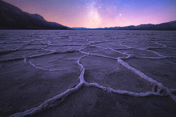 Beautiful, inspiring landscape and halite texture of the Badwater Basin salt flats under a milky...