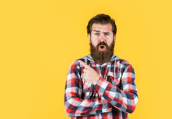 Obraz premium surprised stylish bearded guy with trendy hairstyle wear checkered shirt, surprise