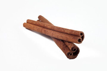 Cinnamon sticks on a white background, isolate, selective focus.