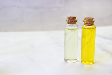 Various types of vegetable oil bottle and glass bottle on light background.