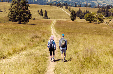 family walk along mountain trails