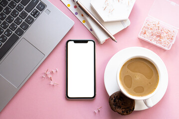 Lady freelancer's home pastel pink workplace, cup of coffee and smartphone mock-up