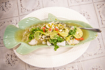 Steamed Squid with Lemon, hot and spicy squid steamed with lime - Thai food