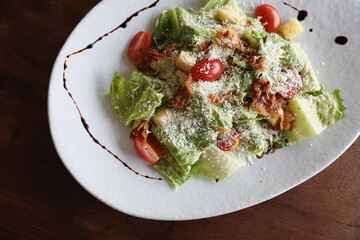 caesar salad appetizer on wooden background