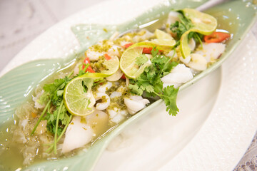 Steamed Squid with Lemon, hot and spicy squid steamed with lime - Thai food