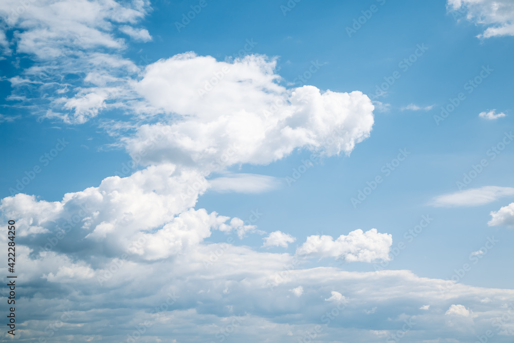 Poster Blue sky background with white fluffy clouds in sunny day.