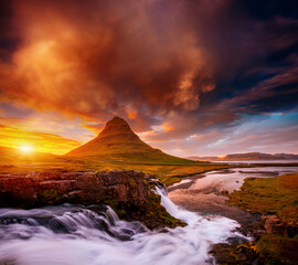 Incredible photo of Kirkjufellsfoss waterfall at sunset. Location famous place Kirkjufell volcano, Iceland, Europe.