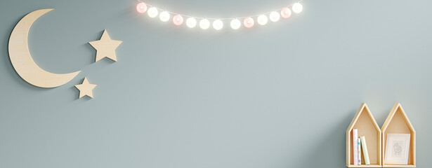 Home decor with moon, stars and toy houses and a beautiful line of lamps with moss green background.