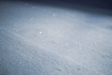 Abstract photo of snow  at night. Visible film grain effect.