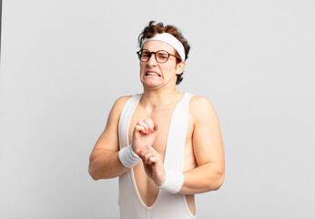 humorous sport man feeling disgusted and nauseous, backing away from something nasty, smelly or...