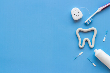 Toothbrush with tube of toothpaste and dental floss. Oral care and dental hygiene