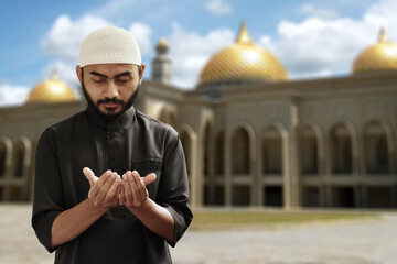 Religious asian muslim man praying