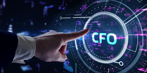 Business, Technology, Internet and network concept. Young businessman working on a virtual screen of the future and sees the inscription: CFO