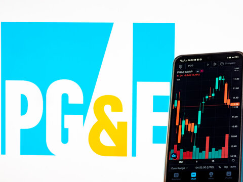 In this photo illustration the stock market information of Pacific Gas and Electric Company seen displayed on a smartphone with the Pacific Gas and Electric Company logo in the background.