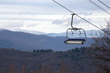 Empty chairlift seat over Karpathian mountains, Krasia ski resort, Ukraine