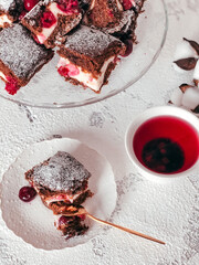 Homemade Brownie pie with cream cheese and cherries.