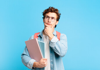 young student boy thinking, feeling doubtful and confused, with different options, wondering which...
