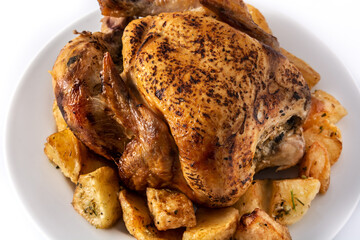 Homemade roasted chicken with potatoes isolated on white background. 