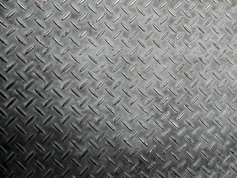 Silver and black painted metallic plate anti slip surface. Metal diamond plate texture.