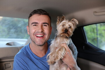 Handsome man traveling with his dog