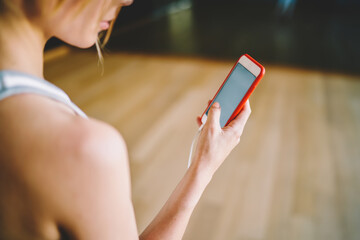 Woman reading message on smartphone