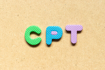 Fototapeta na wymiar Foam alphabet letter in word CPT (Abbreviation of Carriage Paid To) on wood background