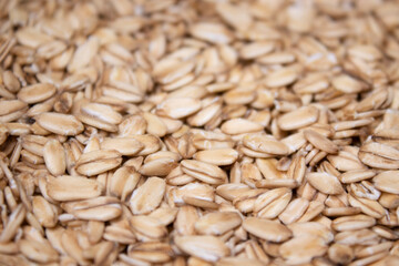 Macro Oatmeal texture. oat flakes food background. Healthy breakfast concept. Muesli cereals.