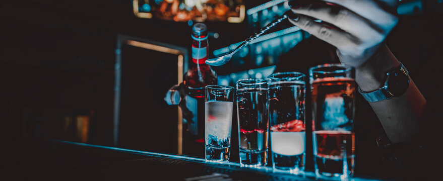 Bartender Making Collection Of Colorful Shots. Set Of Cocktails At The Bar