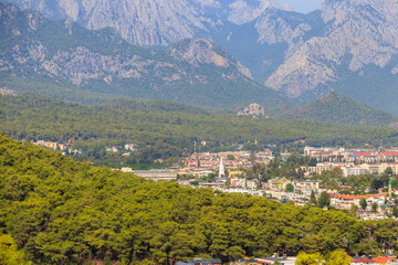 Obraz premium View of Kemer town on a coast of the Mediterranean sea in Antalya province, Turkey. Turkish Riviera. View from a mountain