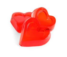 Tasty heart shaped jelly candies on white background