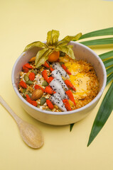 Healthy food Mango smoothie bowl Fresh fruit smoothie is good for the body. with mango, banana, nuts, seeds, papaya, almonds, sunflower and homemade granola for healthy