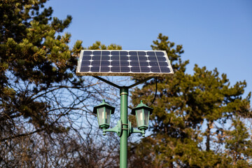 Solar battery connected to the lantern in the park. A very efficient method for a cleaner environment without additional costs