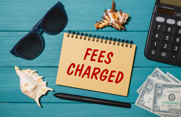 Craft notebook with the words FEES CHARGED