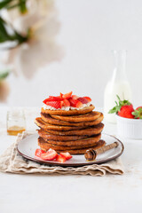 Stack of french toast with cottage cheese, honey and strawberries for breakfast. Selective focus