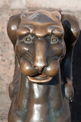 Fototapeta na wymiar Portrait of the Griffin, bronze winged lion statue