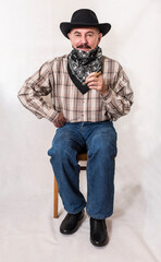 The cowboy with mustache, in a black hat smoking a cigar