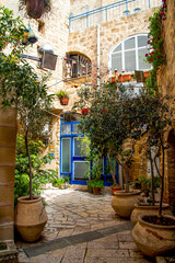 Fototapeta na wymiar Tel Aviv, Israel - March 15, 2021: one of the narrow streets of old Jaffa
