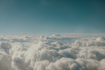 Naklejka premium Fluffy white clouds from above