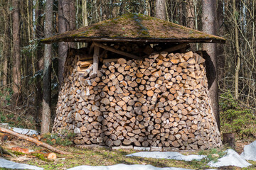 Circular or cylindrical structure, pile or stack composed of blocks, pieces or logs of wood and...