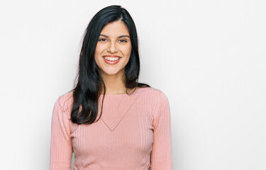 Young hispanic woman wearing casual clothes with a happy and cool smile on face. lucky person.