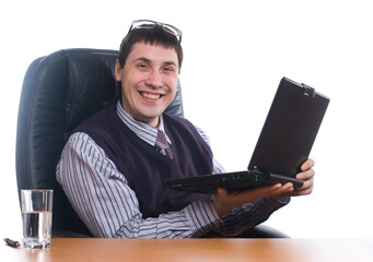 Portrait of a young businessman with laptop