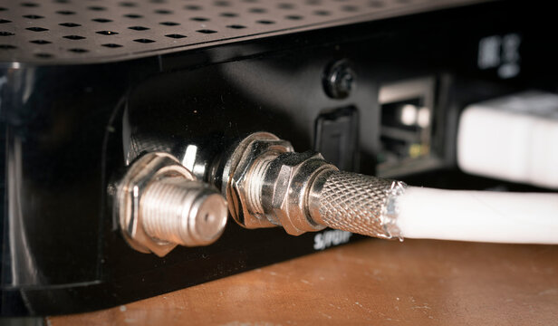 Plugs inserted into the device close up